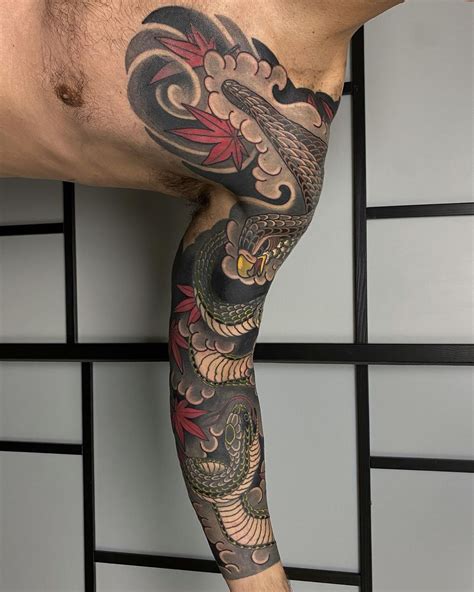 full arm snake tattoo.